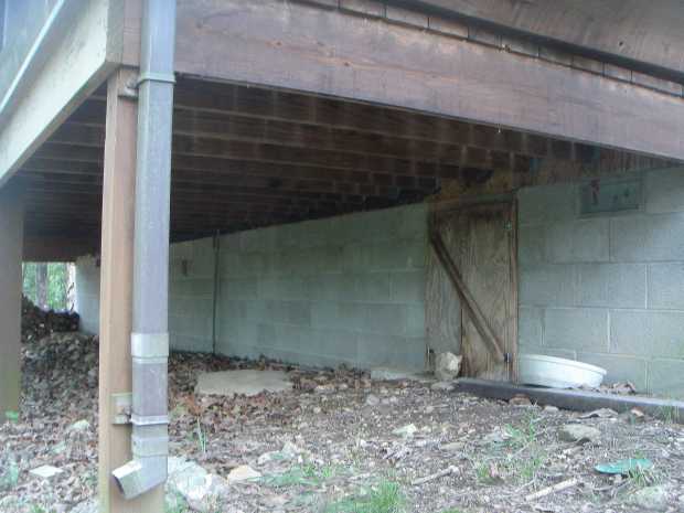 Cabin crawlspace door at Caro Drive