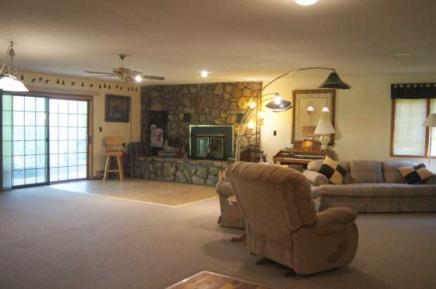 Fireplace and living area in cabin, Caro Drive