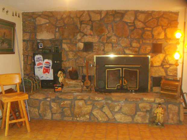 Fireplace in cabin, Caro Drive