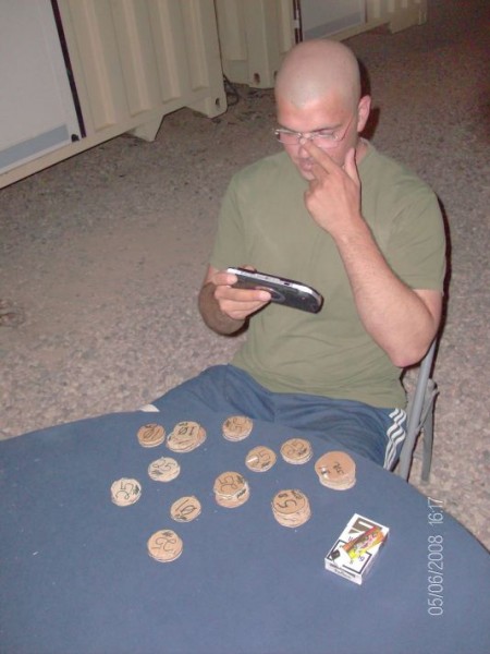 photo from Iraq showing improvised poker chips and deck of cards